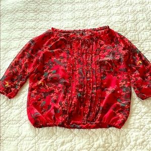 Pink floral shear Express blouse.